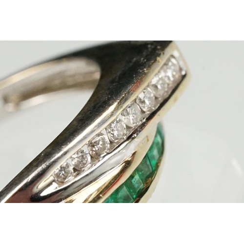 66 - Emerald and diamond 14ct yellow and white gold ring, eight graduated square cut emeralds, channel se... 