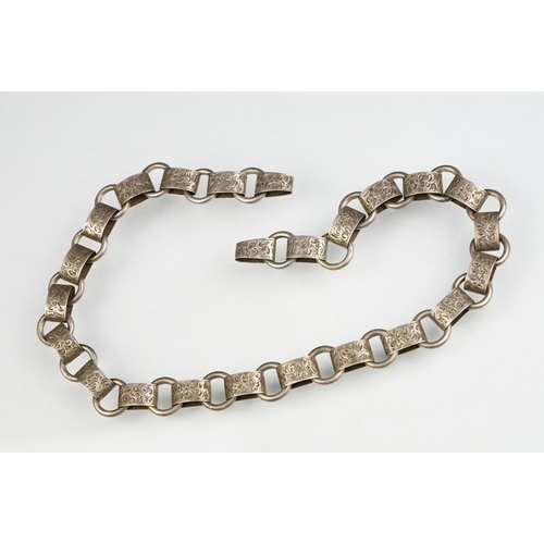 69 - 19th century white metal book chain, missing clasp, engraved foliate scroll links, length approx 45c... 