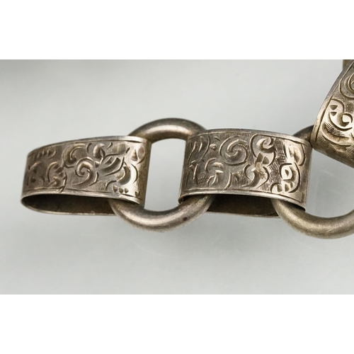 69 - 19th century white metal book chain, missing clasp, engraved foliate scroll links, length approx 45c... 