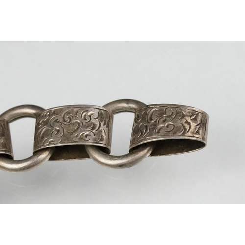 69 - 19th century white metal book chain, missing clasp, engraved foliate scroll links, length approx 45c... 