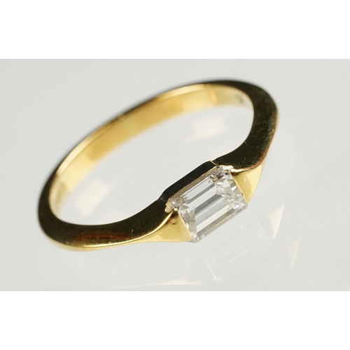 71 - Diamond 18ct yellow gold ring, rectangular step cut diamond with truncated shoulders, measuring appr... 