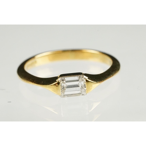 71 - Diamond 18ct yellow gold ring, rectangular step cut diamond with truncated shoulders, measuring appr... 