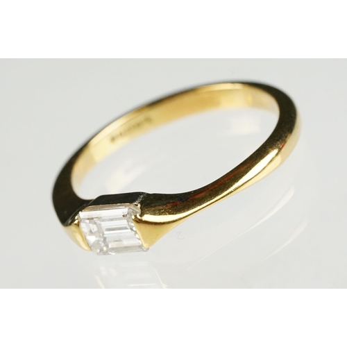 71 - Diamond 18ct yellow gold ring, rectangular step cut diamond with truncated shoulders, measuring appr... 