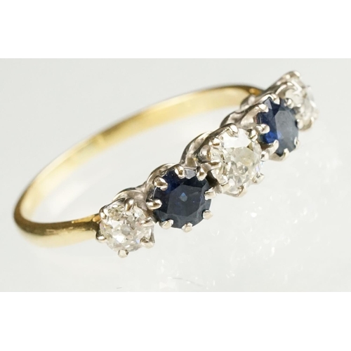 73 - Sapphire and diamond yellow and white metal set five stone ring, three graduated old round cut diamo... 