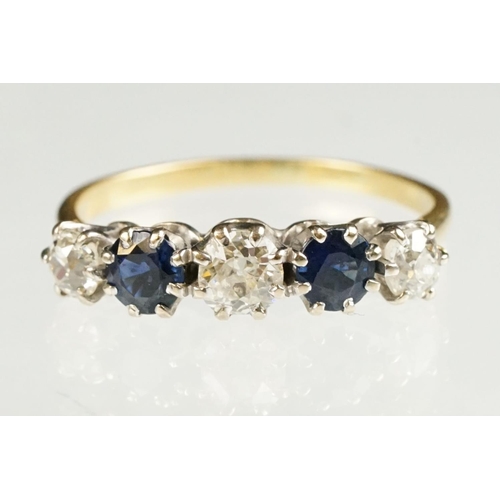 73 - Sapphire and diamond yellow and white metal set five stone ring, three graduated old round cut diamo... 