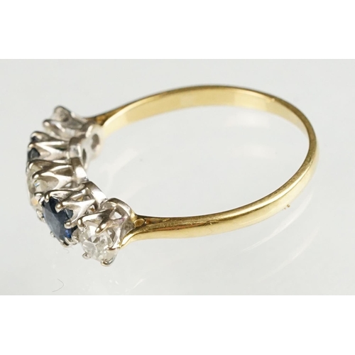 73 - Sapphire and diamond yellow and white metal set five stone ring, three graduated old round cut diamo... 