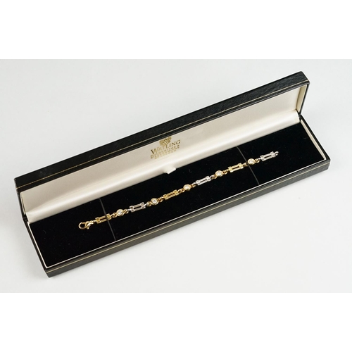 75 - John Watling diamond 18ct yellow and white gold line bracelet, five round brilliant cut diamonds, to... 