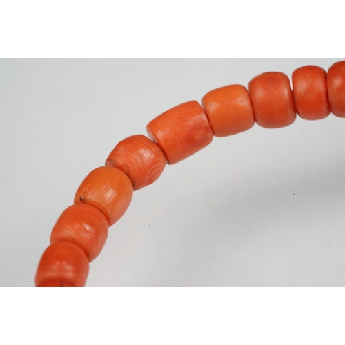 81 - Early 20th century coral graduated bead necklace with 9ct yellow gold clasp, the largest bead measur... 