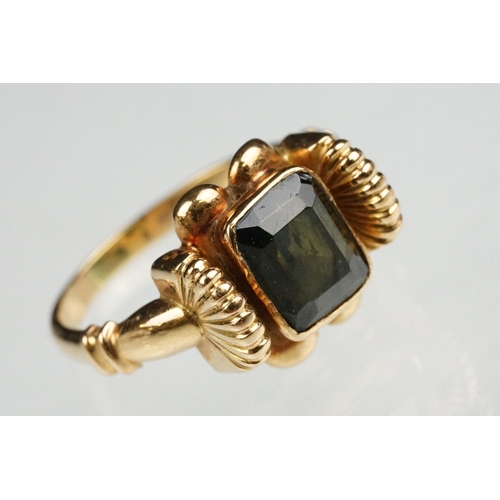 86 - Green tourmaline 18ct yellow gold ring, the rectangular mixed cut tourmaline measuring approx 8 x 6.... 