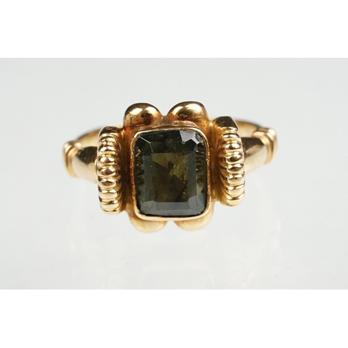 86 - Green tourmaline 18ct yellow gold ring, the rectangular mixed cut tourmaline measuring approx 8 x 6.... 