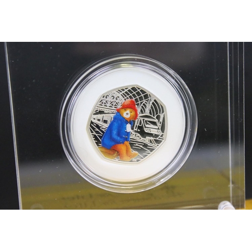 213 - Two United Kingdom Royal Mint silver proof paddington bear 50p coins to include At The Palace & At T... 