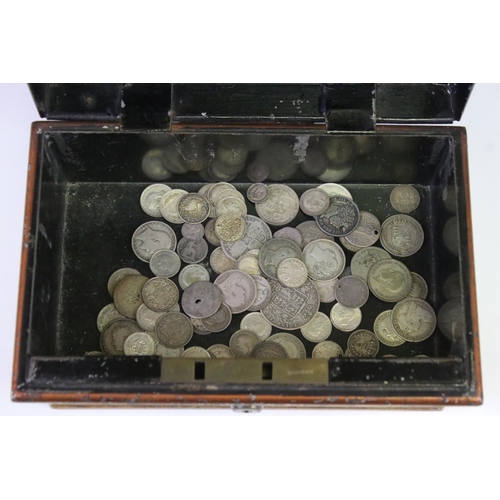 199 - A collection of British pre decimal silver coins contained within a vintage money box to include Que... 