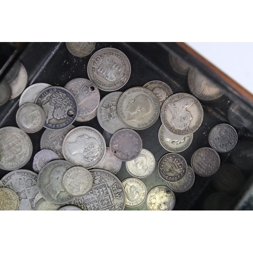 199 - A collection of British pre decimal silver coins contained within a vintage money box to include Que... 