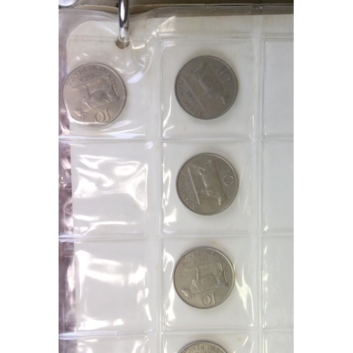 202 - A collection of mainly British coins and banknotes to include commemorative and silver examples.