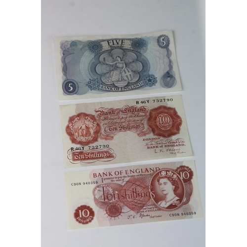 83 - A small collection of British banknotes to include £1, £5 and 10 Shilling examples.