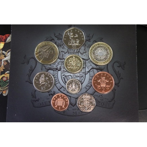 85 - A collection of Royal Mint Christmas coin collectors packs to include 2005, 2004 & 4 x 2008 year set... 