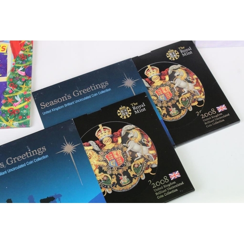 85 - A collection of Royal Mint Christmas coin collectors packs to include 2005, 2004 & 4 x 2008 year set... 