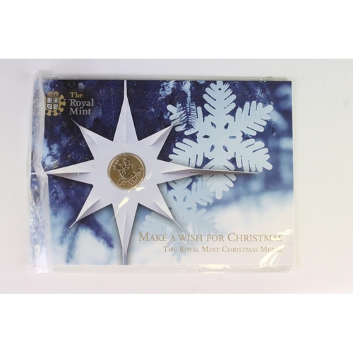 85 - A collection of Royal Mint Christmas coin collectors packs to include 2005, 2004 & 4 x 2008 year set... 