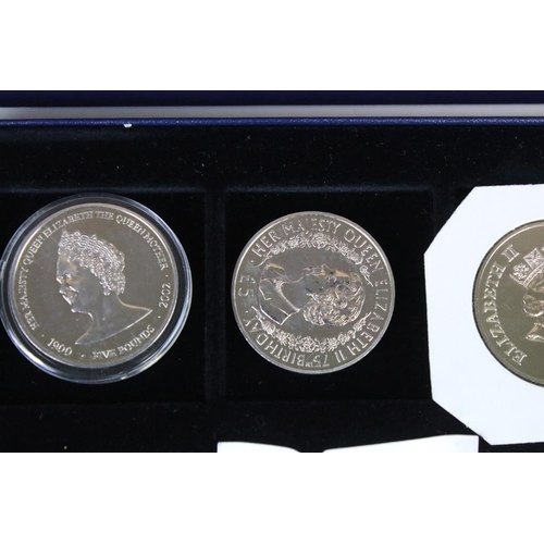 92 - A collection of twelve commemorative crown and £5 coins including silver examples.