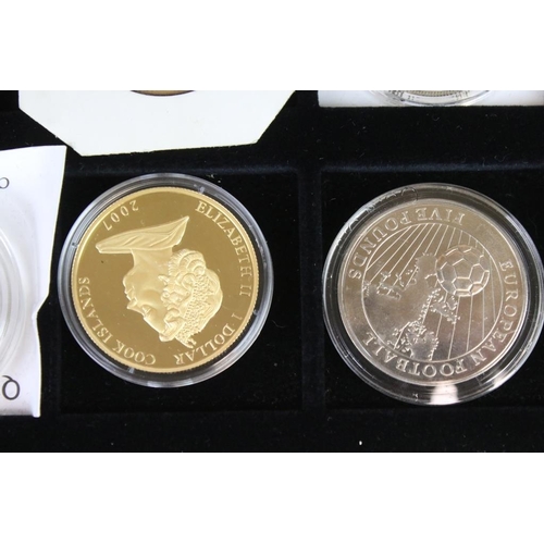 92 - A collection of twelve commemorative crown and £5 coins including silver examples.