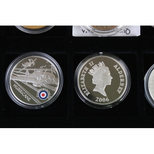 92 - A collection of twelve commemorative crown and £5 coins including silver examples.