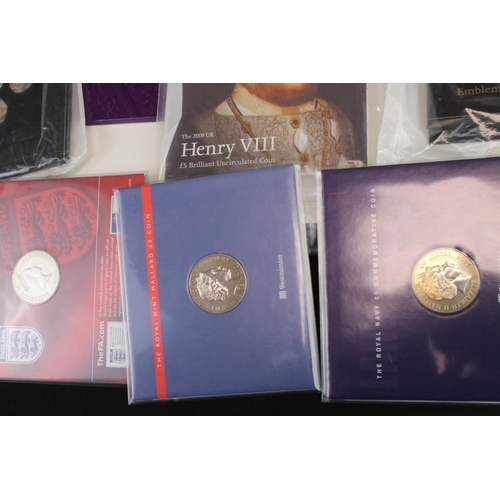 95 - A collection of Royal Mint coin collectors packs to include 2003 Royal Navy £5 coin, 2004 Golden Age... 