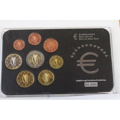 96 - A collection of Uncirculated collectors coin packs to include Royal Mint examples together with a co... 