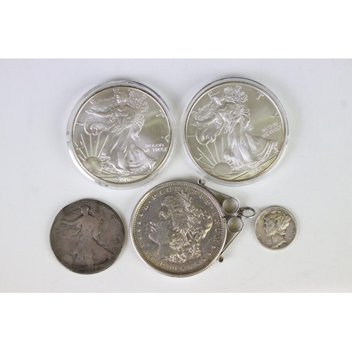 121 - A small collection of United States of America silver coins two include three silver dollars includi... 