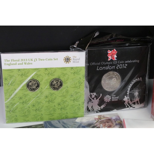 172 - A collection of Royal Mint uncirculated coin sets to include the 2013 2 x £1 coin set, 2012 Olympic ... 