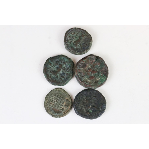 178 - A collection of five early Roman bronze coins.