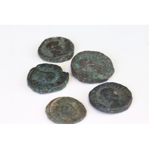 178 - A collection of five early Roman bronze coins.