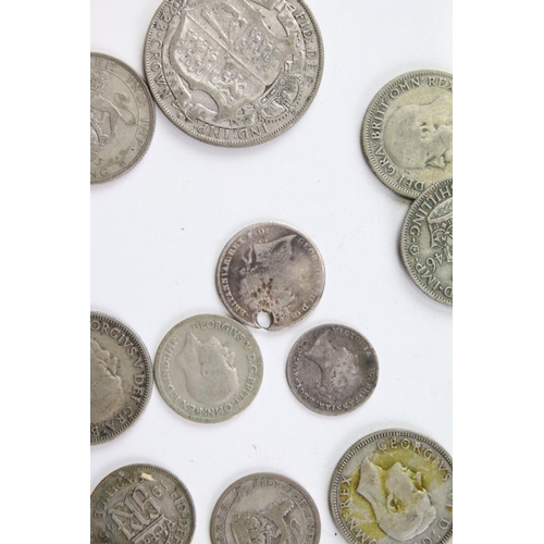 185 - A small collection of British pre decimal silver coins to include pre 1947 and pre 1920 examples.