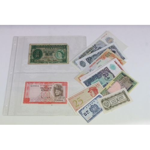 56 - A Collection Of Circulated And Uncirculated World Banknotes To Include Russia, Hong Kong, Malaysia, ... 