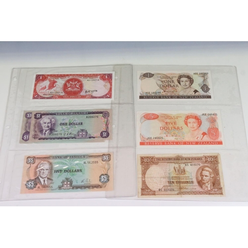 56 - A Collection Of Circulated And Uncirculated World Banknotes To Include Russia, Hong Kong, Malaysia, ... 