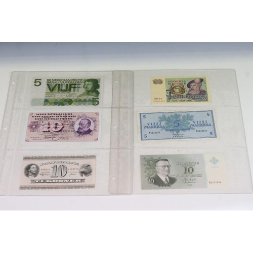 56 - A Collection Of Circulated And Uncirculated World Banknotes To Include Russia, Hong Kong, Malaysia, ... 