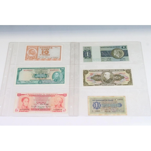 56 - A Collection Of Circulated And Uncirculated World Banknotes To Include Russia, Hong Kong, Malaysia, ... 