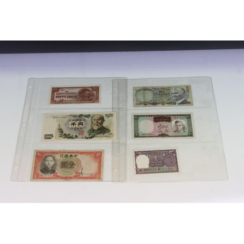 56 - A Collection Of Circulated And Uncirculated World Banknotes To Include Russia, Hong Kong, Malaysia, ... 