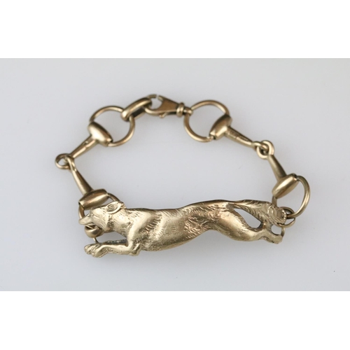 4 - 9ct yellow gold bracelet with central section modelled as a fox, the links modelled as riding stirru... 