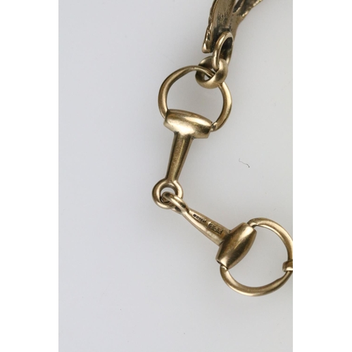 4 - 9ct yellow gold bracelet with central section modelled as a fox, the links modelled as riding stirru... 