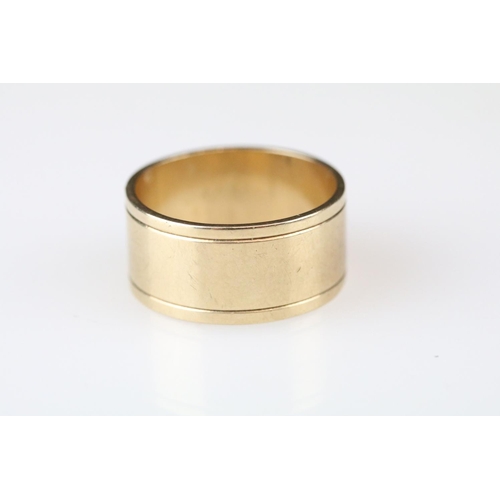 8 - 9ct yellow gold wedding band, width approx 10mm, ring size R