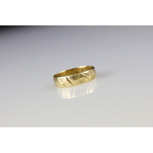 12 - 18ct yellow gold wedding band, engraved decoration, width approx 4.5mm, ring size M½