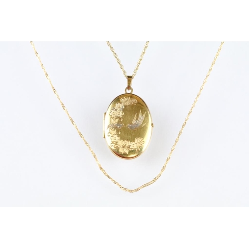 14 - 9ct yellow gold oval locket pendant necklace; together with a 9ct yellow gold helix link chain neckl... 