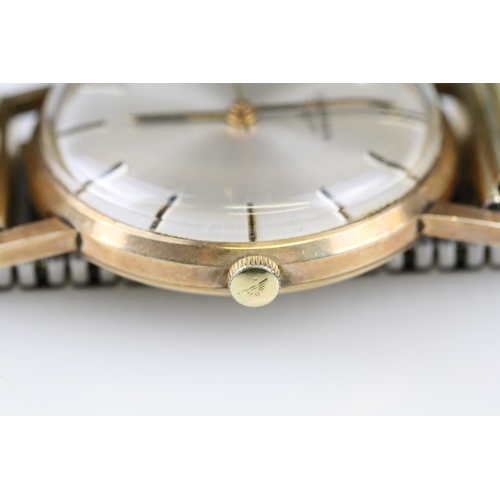 533 - Longines gentleman's wristwatch having a silvered sunburst dial with baton markings to the chapter r... 