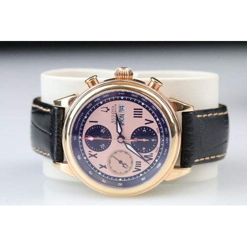 557 - Bulova Accutron Gents watch, no. C999285 A9, three subsidiary dials, date aperture, pink dial, navy ... 