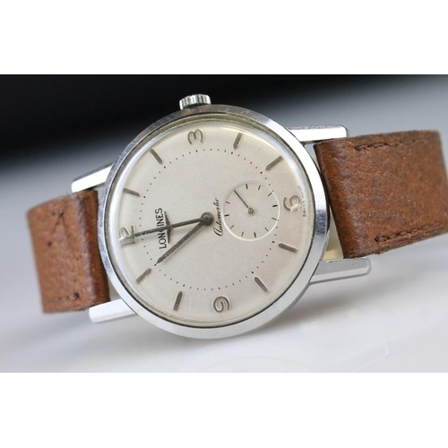 559 - Longines automatic gents wristwatch, silvered dial and seconds dial, Arabic and baton numeral marker... 