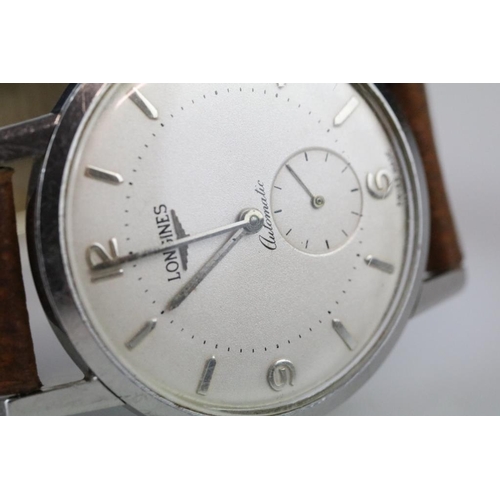 559 - Longines automatic gents wristwatch, silvered dial and seconds dial, Arabic and baton numeral marker... 