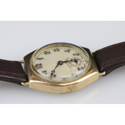 570 - Gents wristwatch, yellow metal case, circular champagne dial, Arabic numerals, poker hands, replacem... 