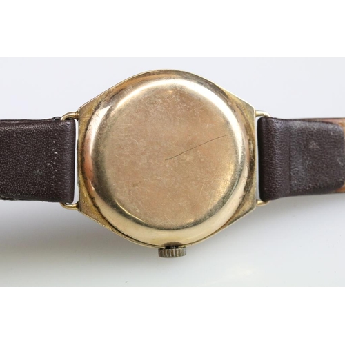 570 - Gents wristwatch, yellow metal case, circular champagne dial, Arabic numerals, poker hands, replacem... 