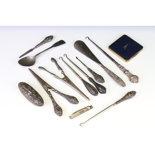 659 - Silver handled items to include two pairs of glove stretchers, a shoe horn, four button hooks, Irish... 