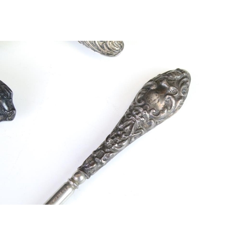 659 - Silver handled items to include two pairs of glove stretchers, a shoe horn, four button hooks, Irish... 